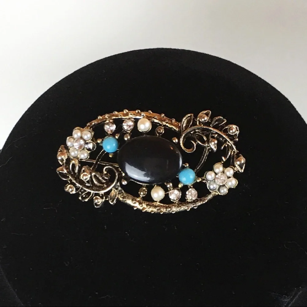 Vintage-Inspired Gold Floral Brooch with Black Center and Turquoise Accents